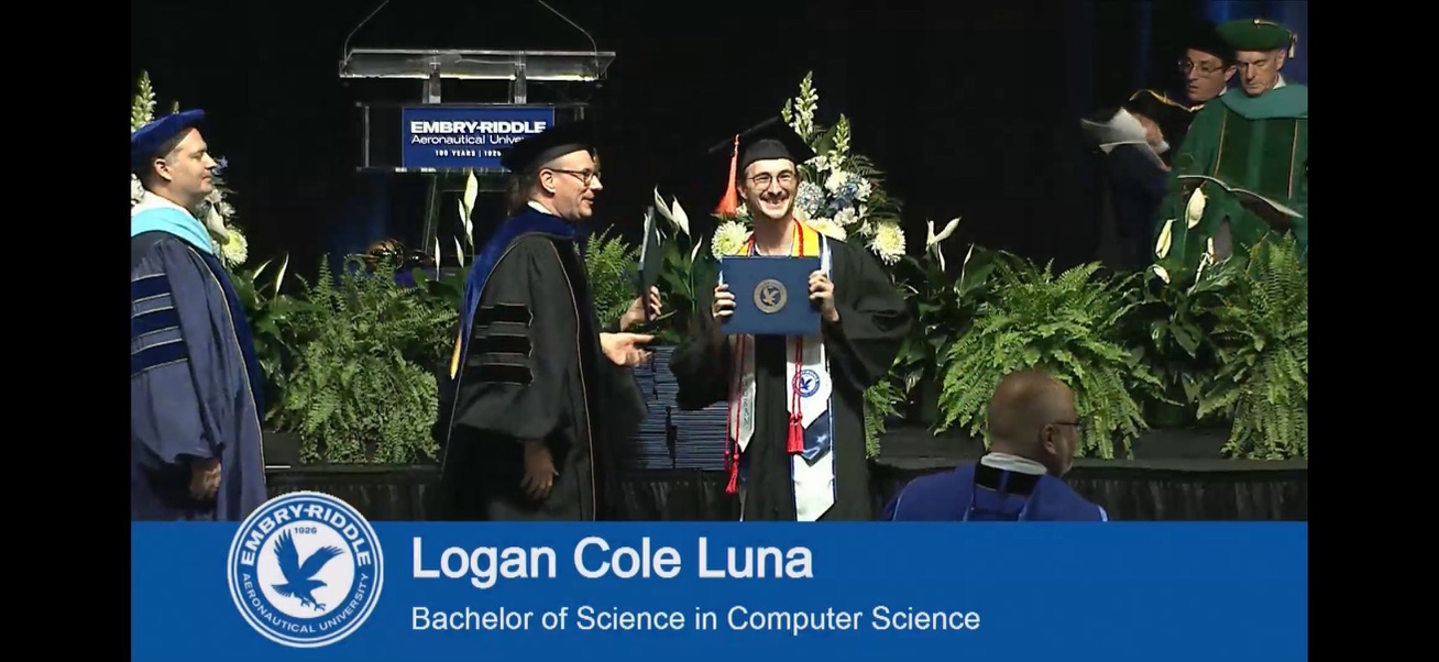 Logan Luna receiving his B.S. diploma at Embry-Riddle Aeronautical University commencement